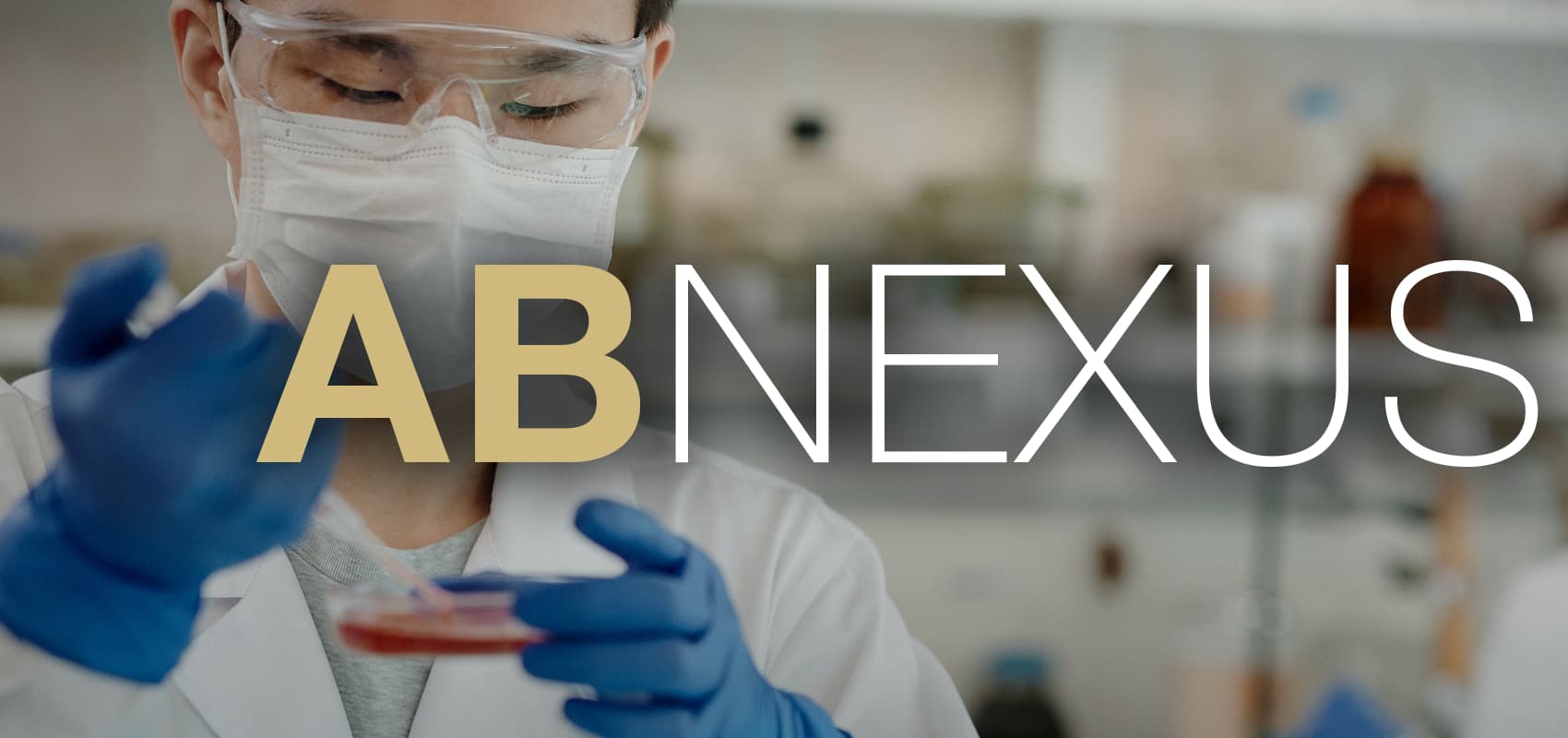 Lab worker examining sample with AB Nexus written on image