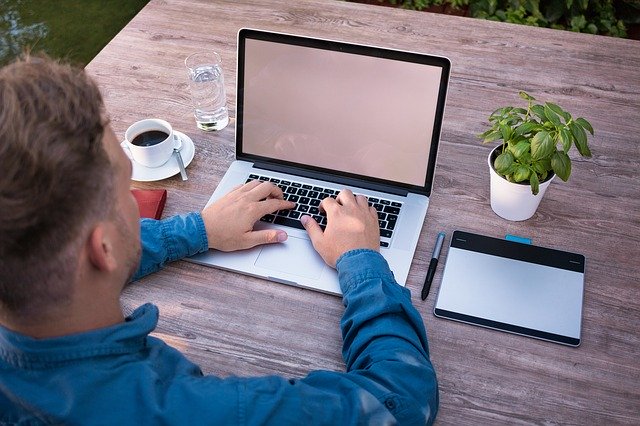 Student typing on computer