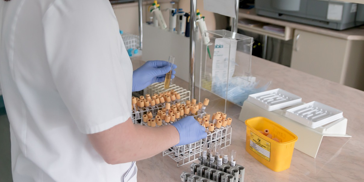 lab worker arranging vials