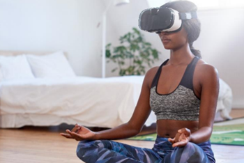 Women meditating with VR headset